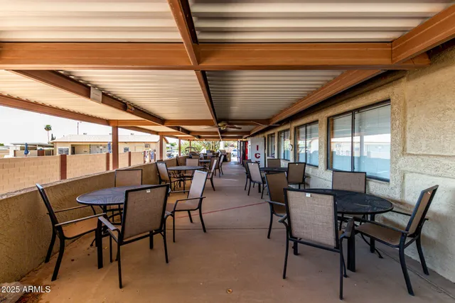 a view of swimming pool with chairs