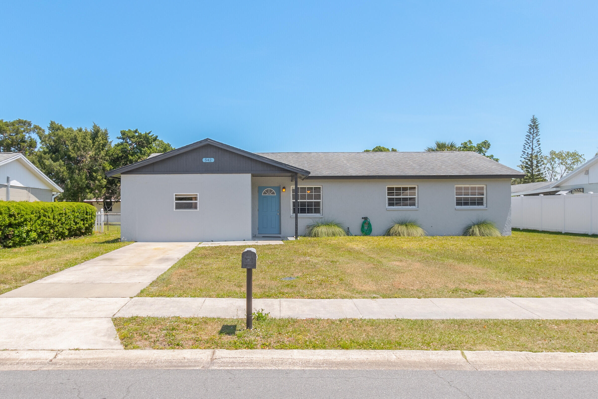 a front view of a house with yard