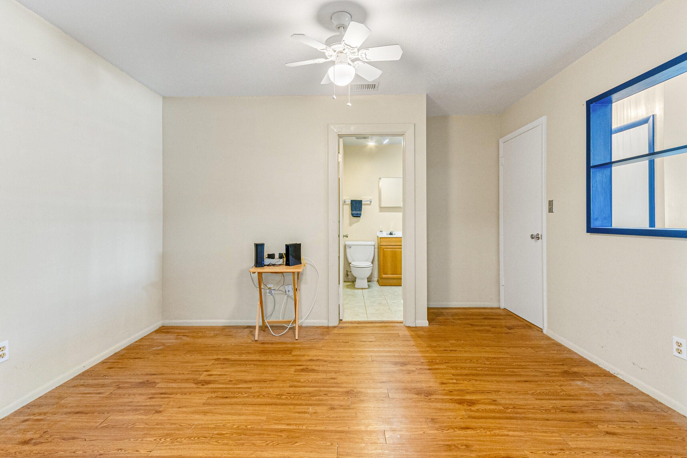 542 Sylvia Road Melbourne, FL 32904 - Photo 16 of 37 a view of empty room with window and ceiling fan