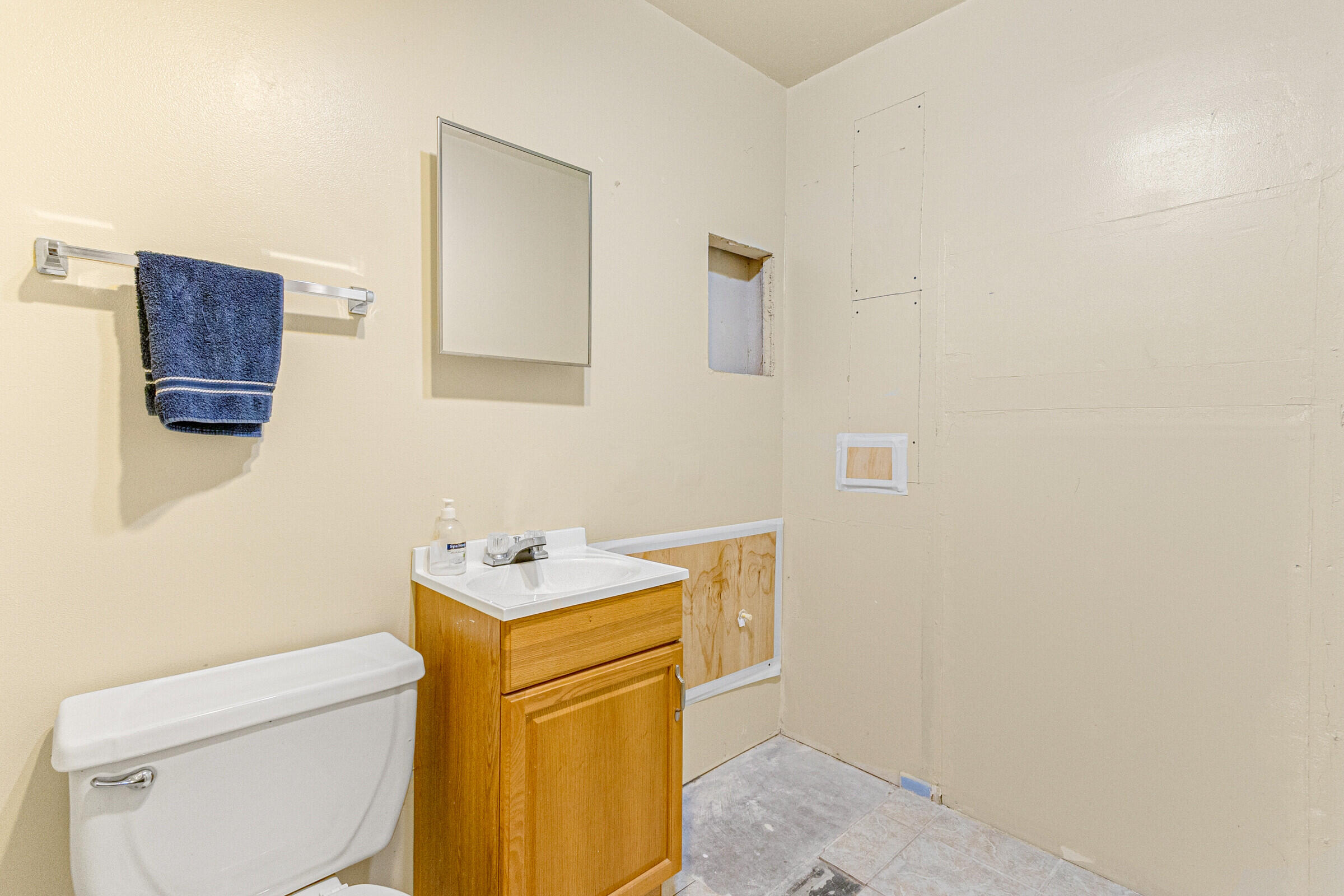 542 Sylvia Road Melbourne, FL 32904 - Photo 19 of 37 a bathroom with a sink toilet and a mirror