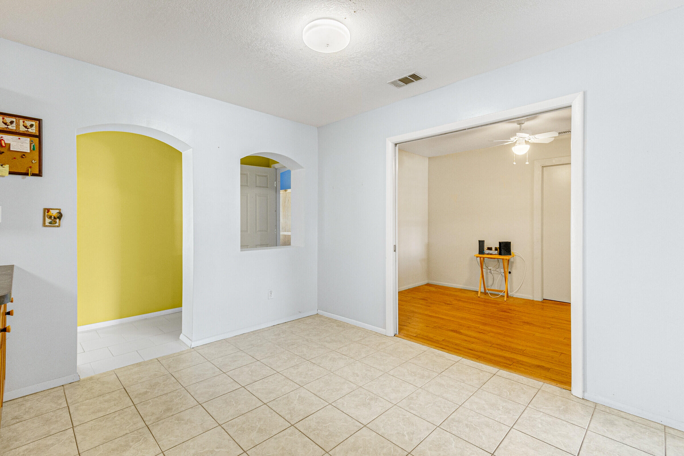 542 Sylvia Road Melbourne, FL 32904 - Photo 20 of 37 a bedroom with a bed and a table