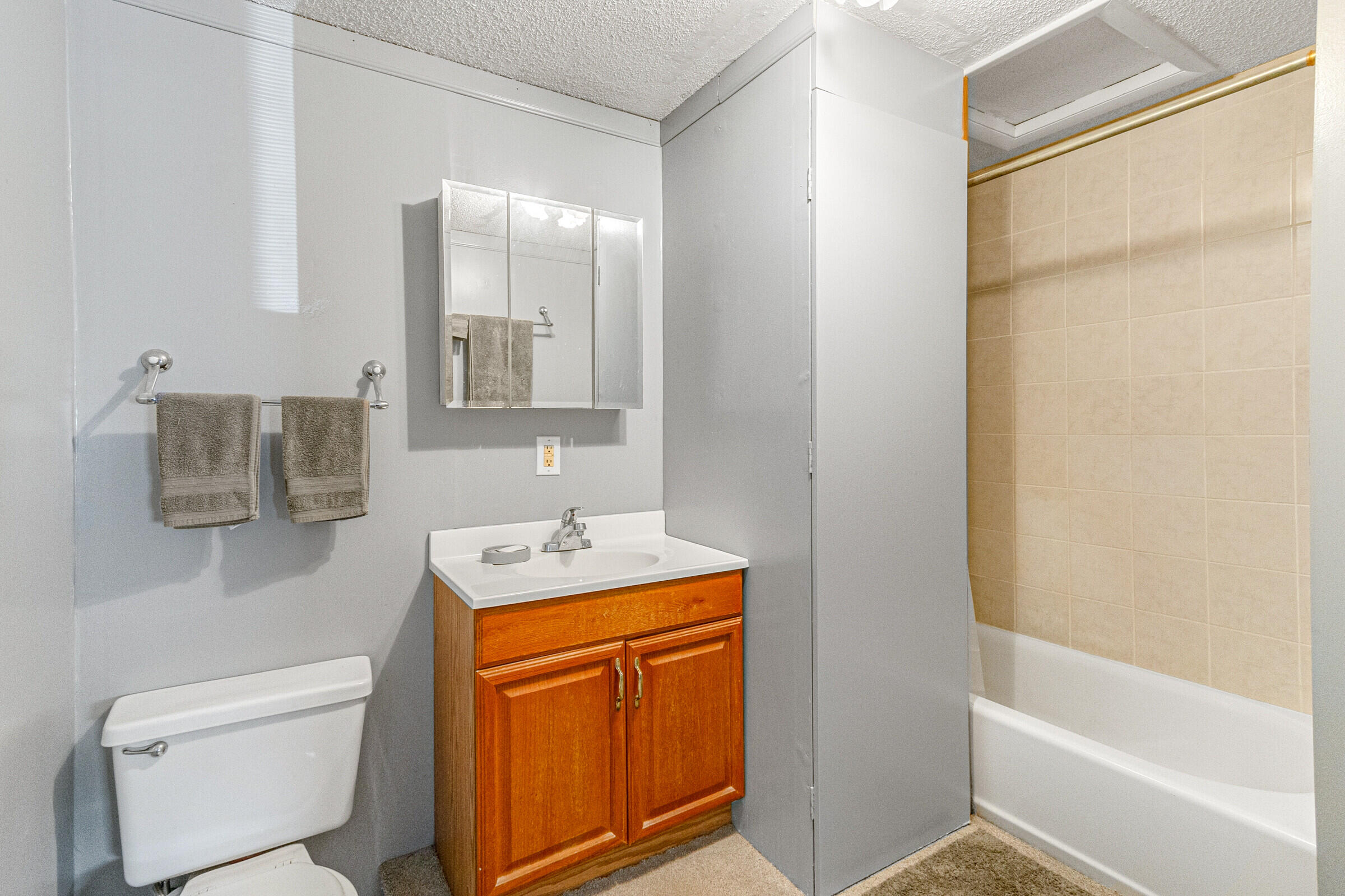542 Sylvia Road Melbourne, FL 32904 - Photo 22 of 37 a bathroom with a granite countertop sink toilet and shower