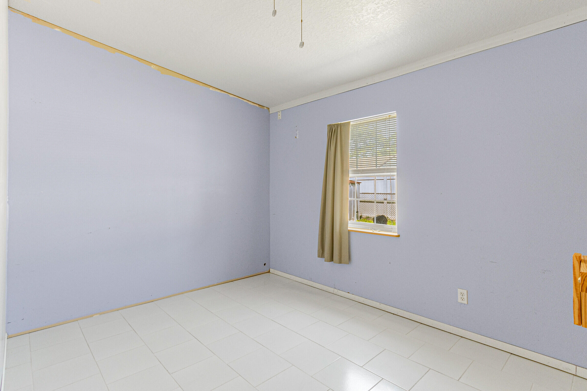 542 Sylvia Road Melbourne, FL 32904 - Photo 24 of 37 a view of an empty room with a window