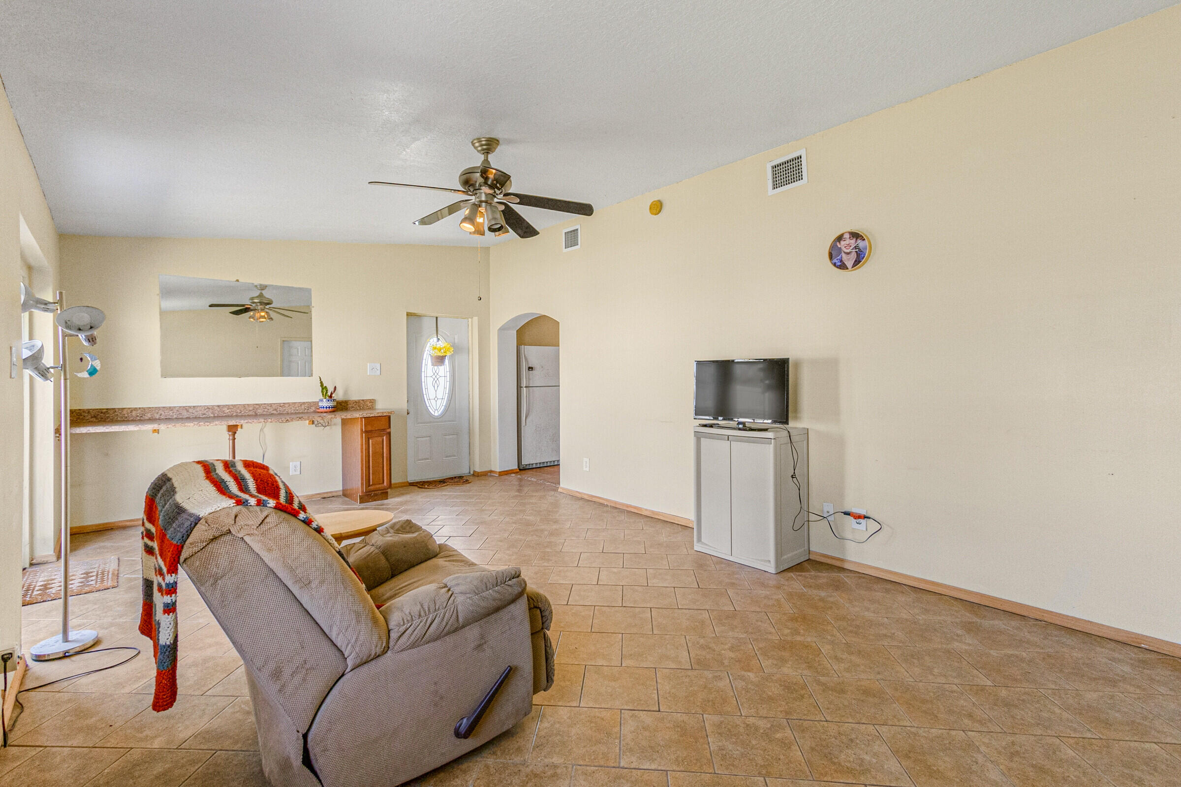 542 Sylvia Road Melbourne, FL 32904 - Photo 26 of 37 a living room with furniture and a flat screen tv