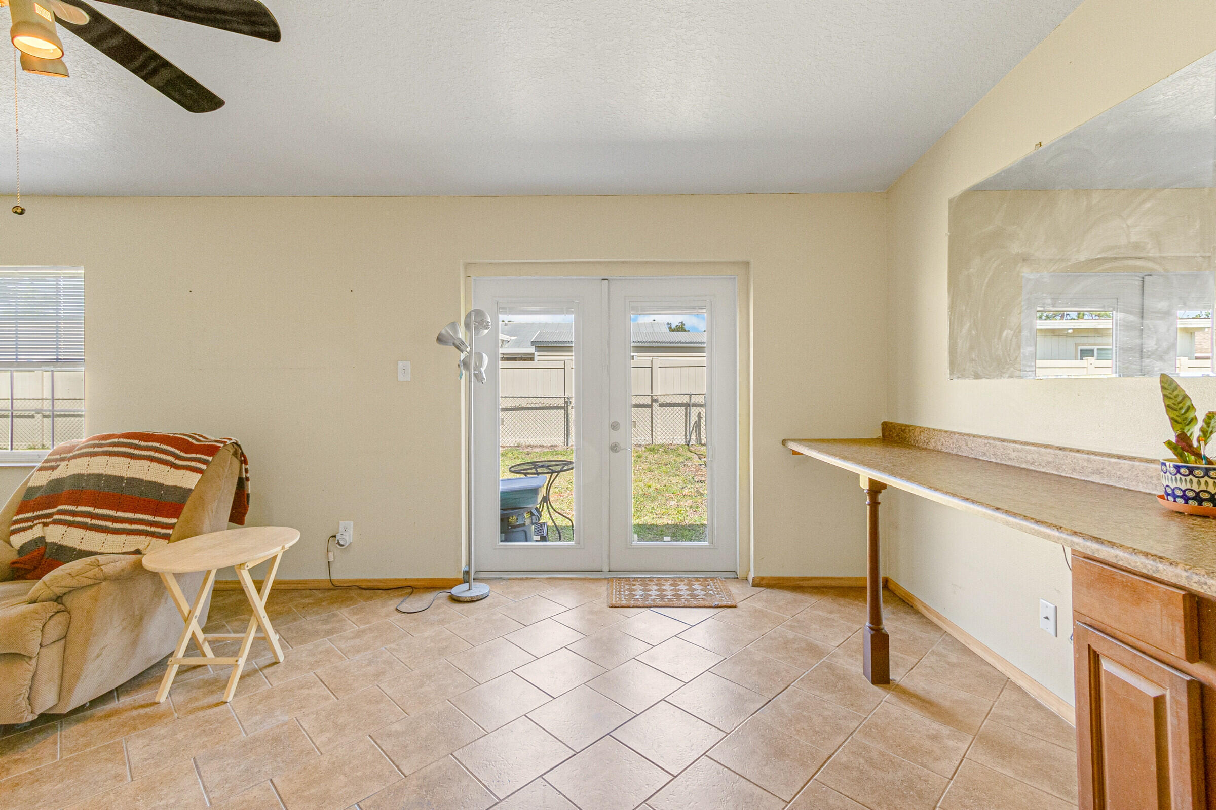 542 Sylvia Road Melbourne, FL 32904 - Photo 28 of 37 a view of a livingroom with furniture and a window