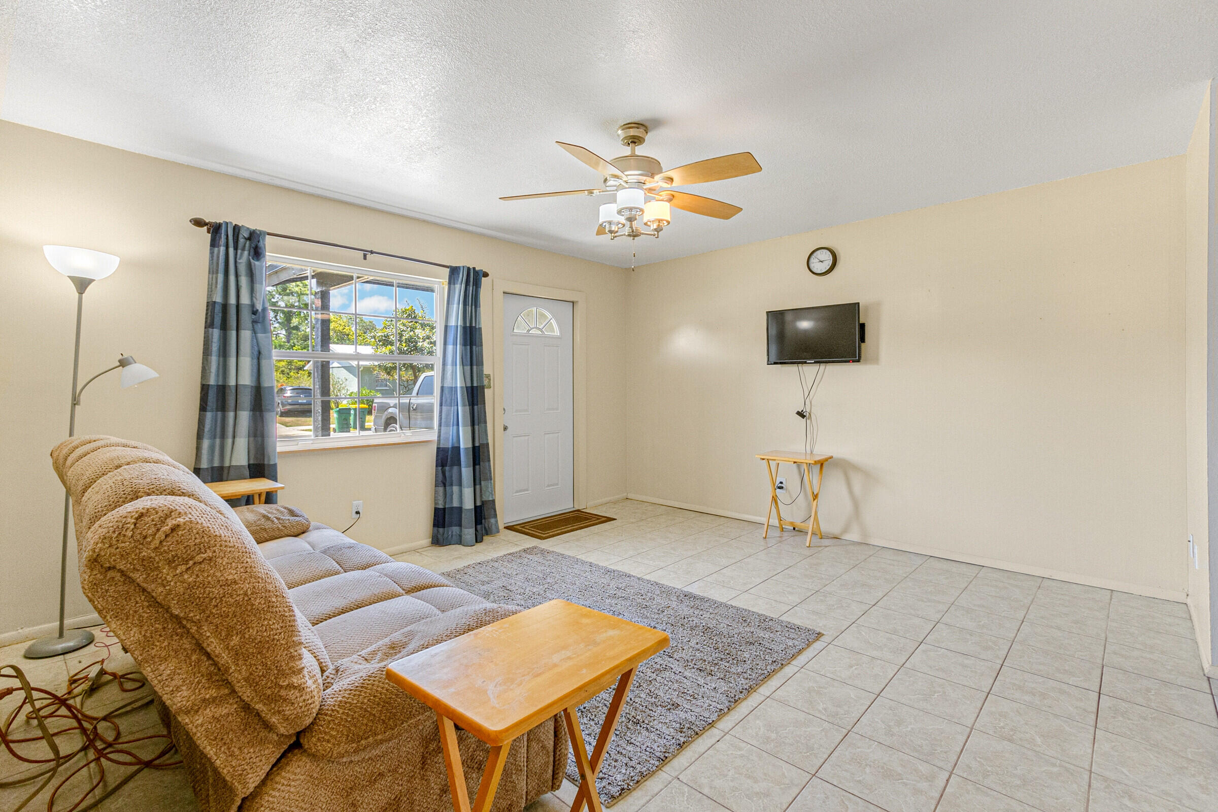 542 Sylvia Road Melbourne, FL 32904 - Photo 3 of 37 a living room with furniture and a window