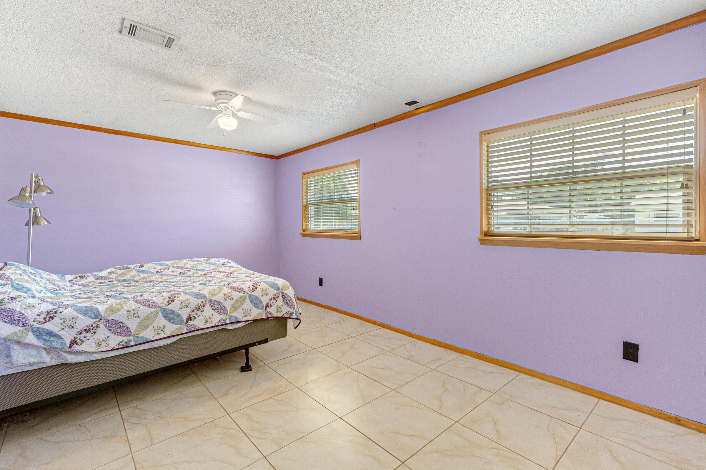 542 Sylvia Road Melbourne, FL 32904 - Photo 36 of 37 a bedroom with a bed and a window