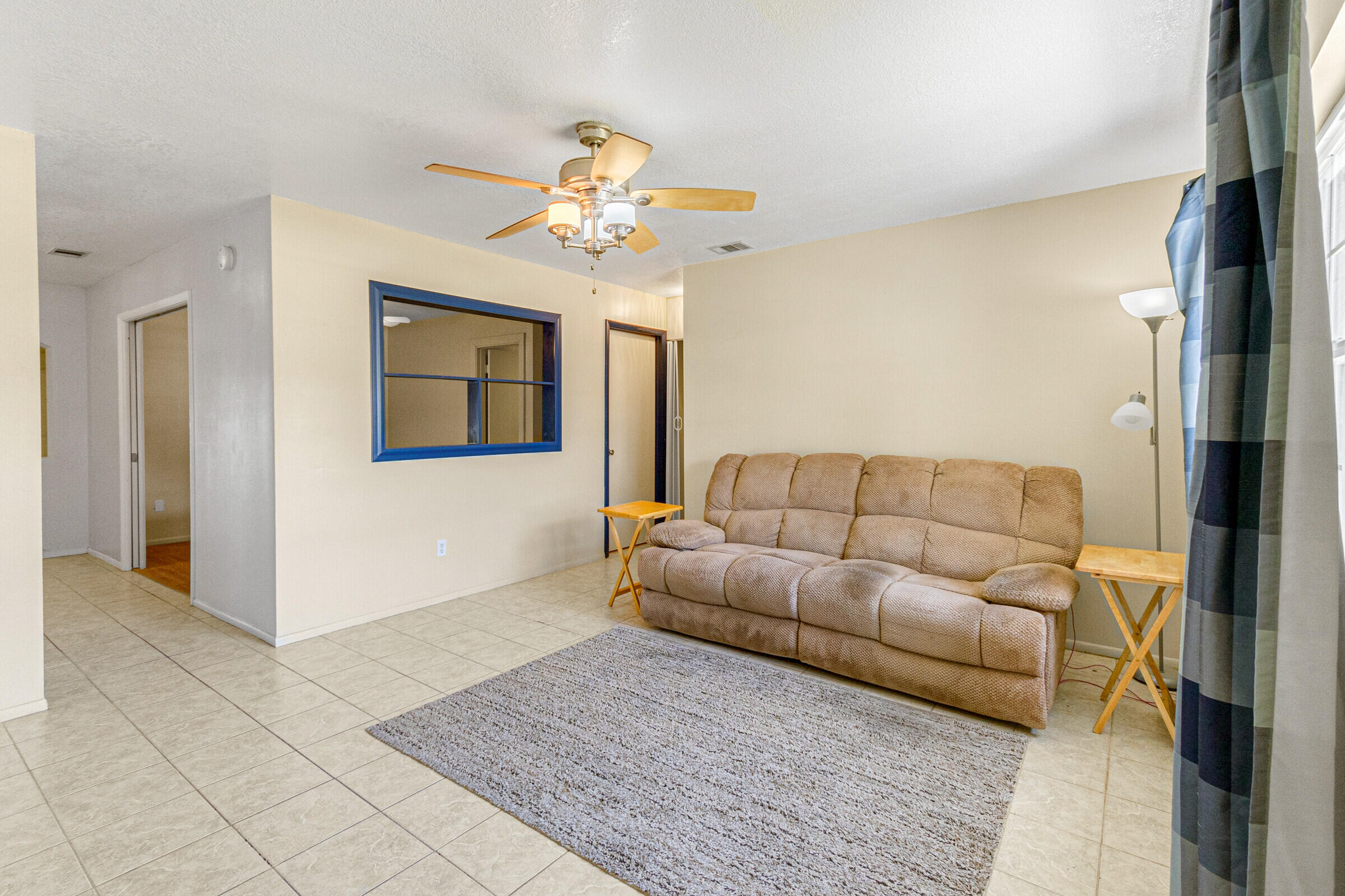 542 Sylvia Road Melbourne, FL 32904 - Photo 7 of 37 a living room with furniture and a chandelier