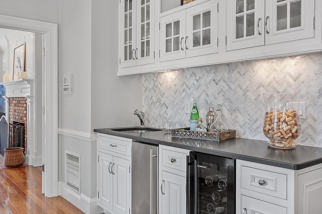 490 Lexington Road Concord, MA 01742 - Photo 14 of 40 a kitchen with stainless steel appliances granite countertop a sink and cabinets