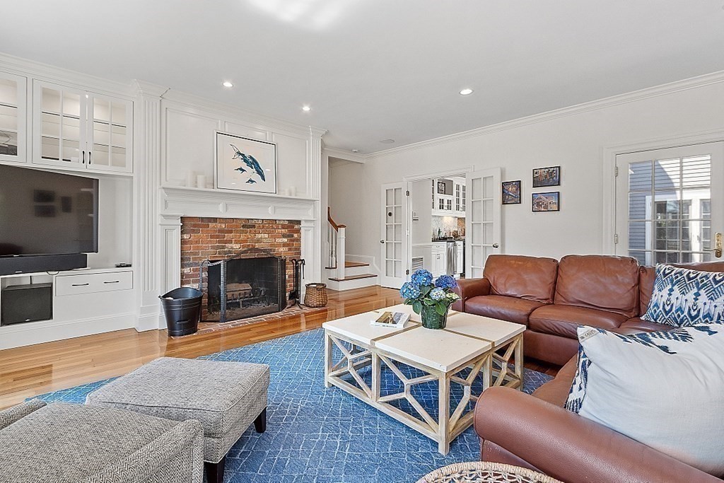 490 Lexington Road Concord, MA 01742 - Photo 16 of 40 a living room with furniture fireplace and flat screen tv