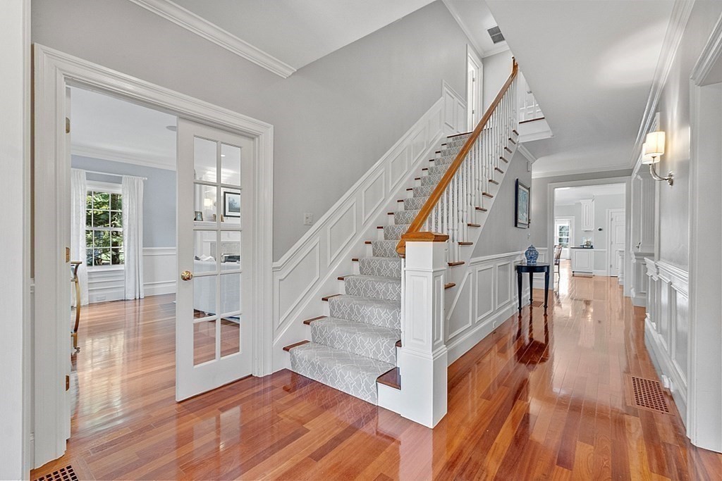 490 Lexington Road Concord, MA 01742 - Photo 18 of 40 a view of entryway and hall with wooden floor