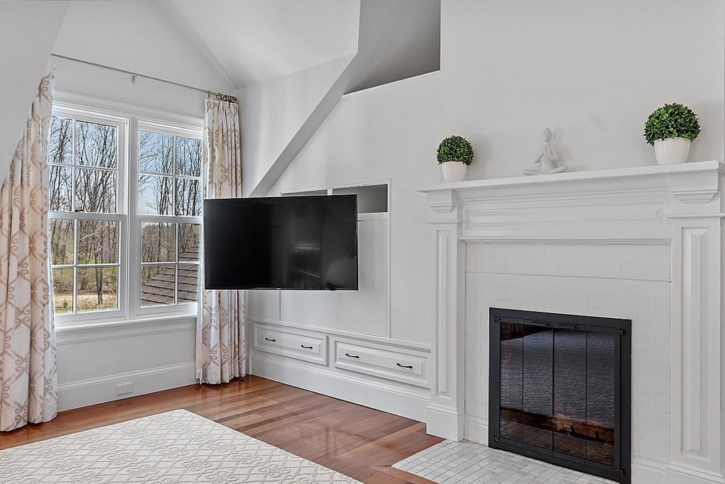 490 Lexington Road Concord, MA 01742 - Photo 20 of 40 a living room with furniture and a flat screen tv