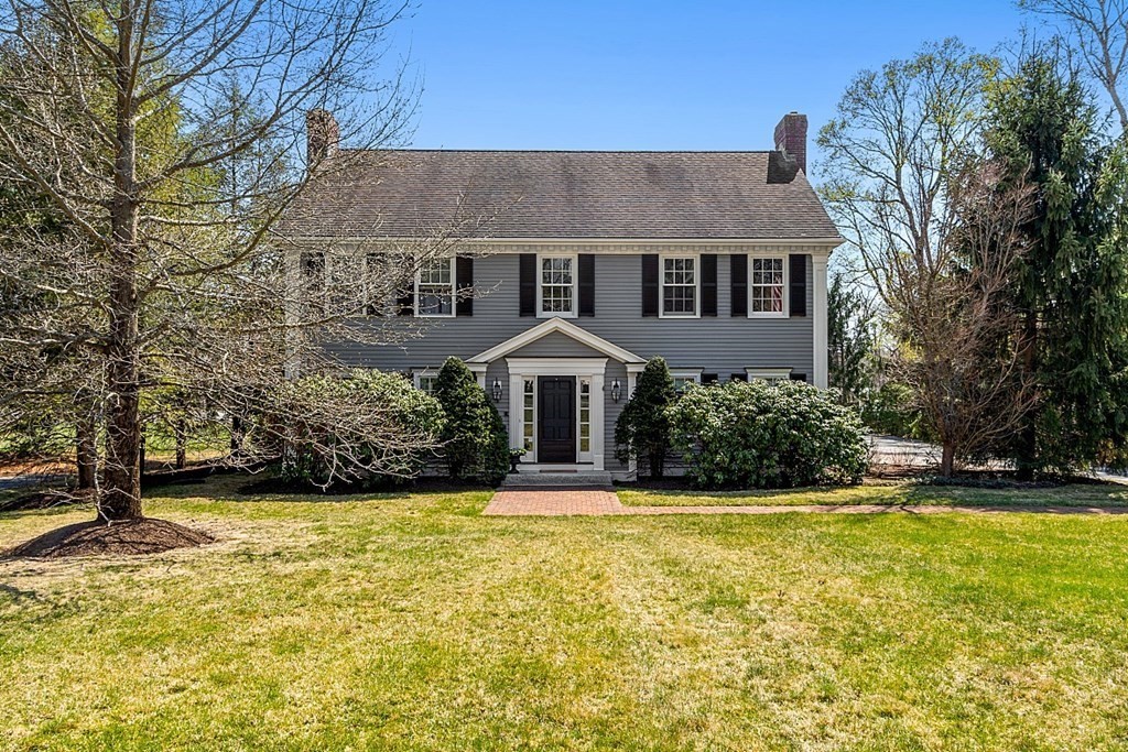 490 Lexington Road Concord, MA 01742 - Photo 2 of 40 a front view of a house with a yard