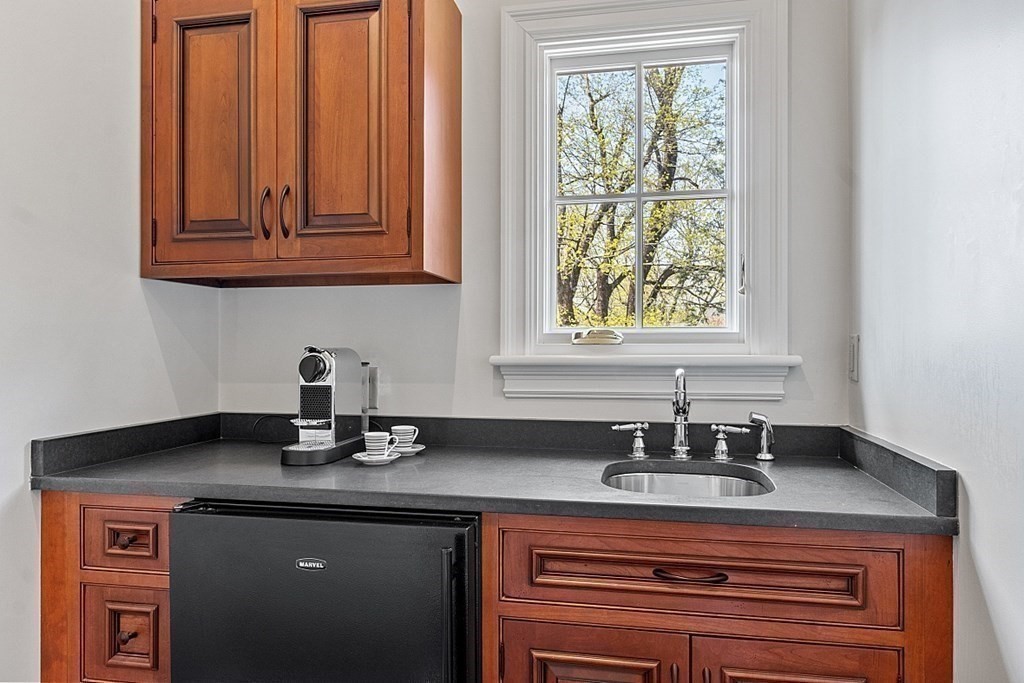 490 Lexington Road Concord, MA 01742 - Photo 24 of 40 a kitchen with a sink cabinets and window