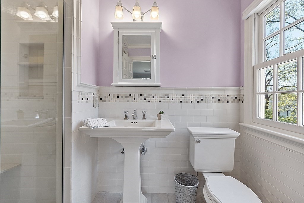 490 Lexington Road Concord, MA 01742 - Photo 27 of 40 a bathroom with a sink a toilet and a mirror