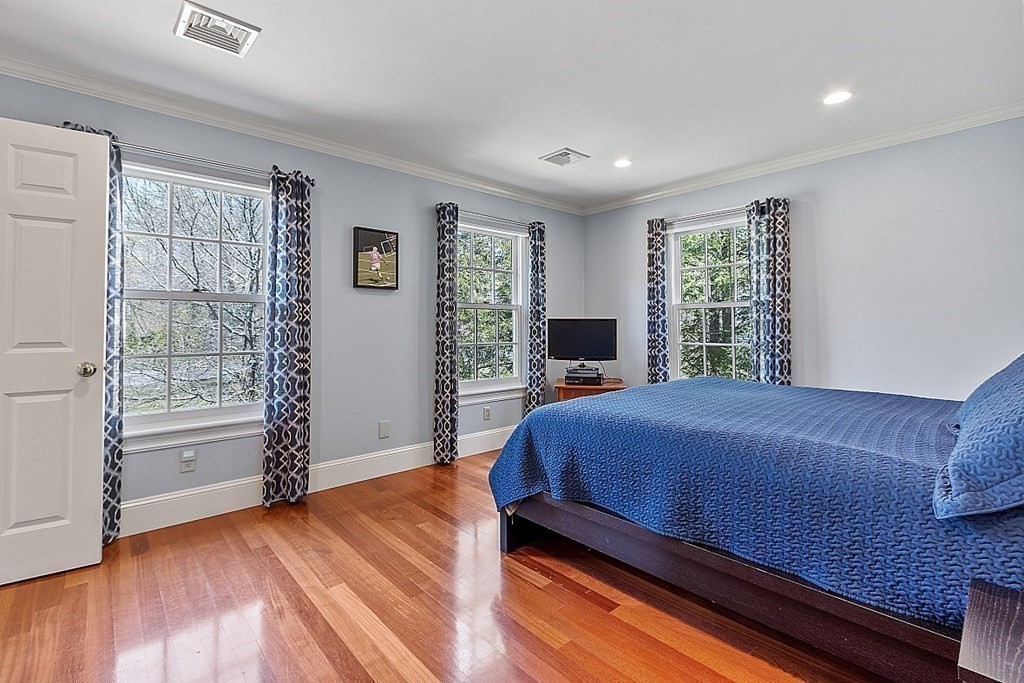 490 Lexington Road Concord, MA 01742 - Photo 29 of 40 a bedroom with a large bed and a window