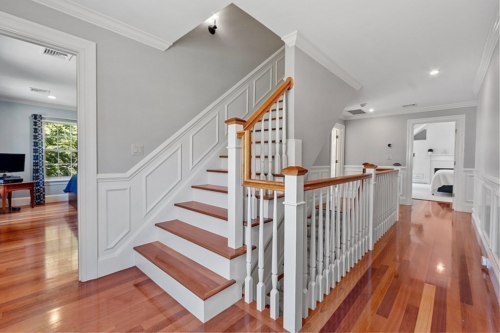 490 Lexington Road Concord, MA 01742 - Photo 31 of 40 a view of entryway and hall with wooden floor