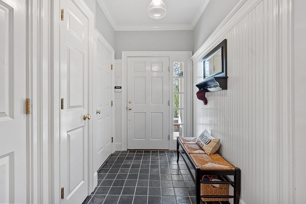 490 Lexington Road Concord, MA 01742 - Photo 36 of 40 a view of a hallway with entryway wooden floor and windows