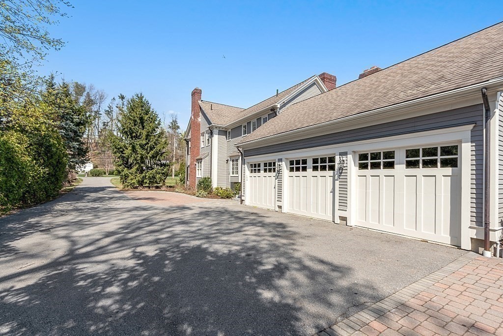490 Lexington Road Concord, MA 01742 - Photo 37 of 40 a view of a house with backyard and trees