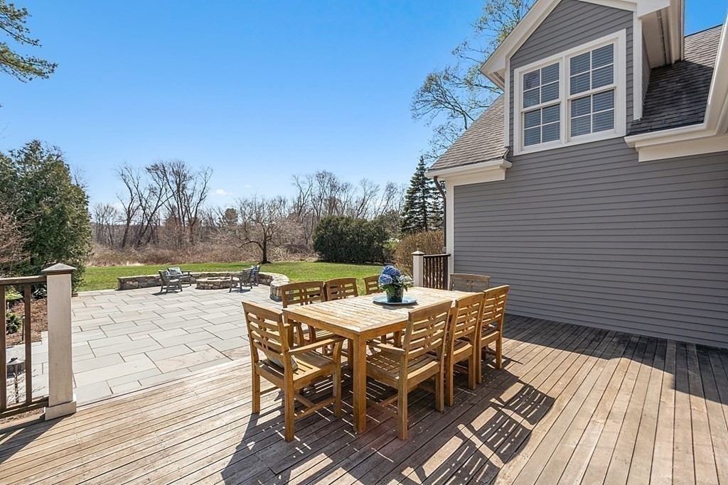 490 Lexington Road Concord, MA 01742 - Photo 39 of 40 a backyard of a house with table and chairs