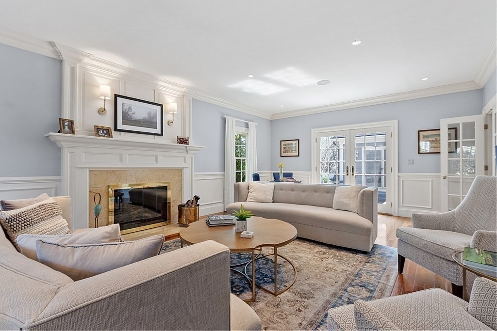 490 Lexington Road Concord, MA 01742 - Photo 5 of 40 a living room with furniture and a fireplace