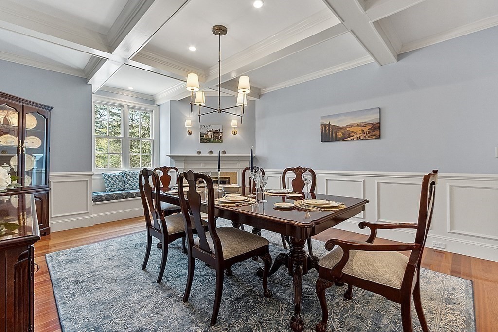 490 Lexington Road Concord, MA 01742 - Photo 8 of 40 a view of a dining room with furniture wooden floor and chandelier
