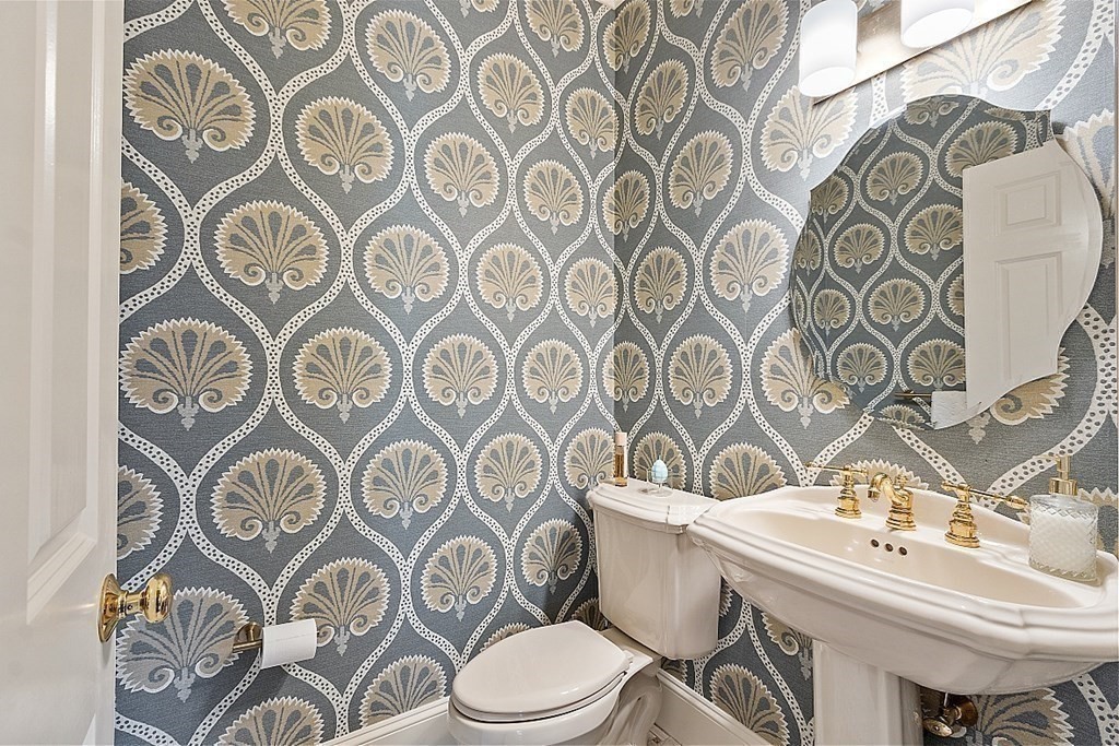 490 Lexington Road Concord, MA 01742 - Photo 9 of 40 a bathroom with a toilet and a sink
