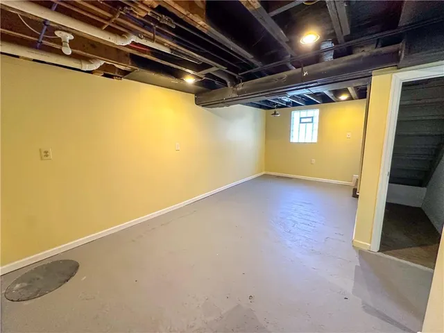 a white toilet sitting next to a bathroom sink