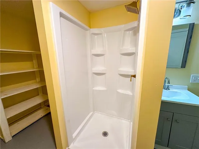 a view of an empty room with a sink