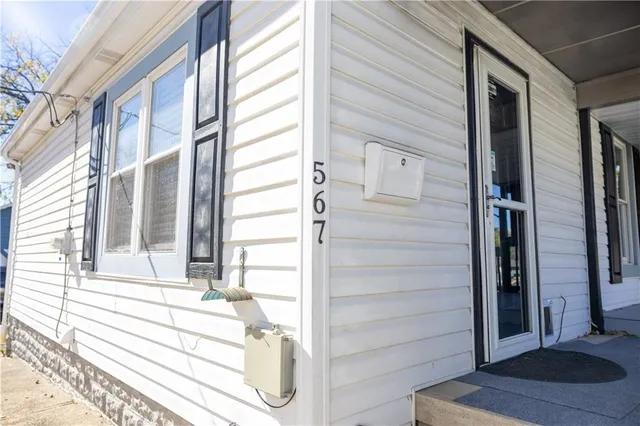 a view of a house with pool and wooden floor