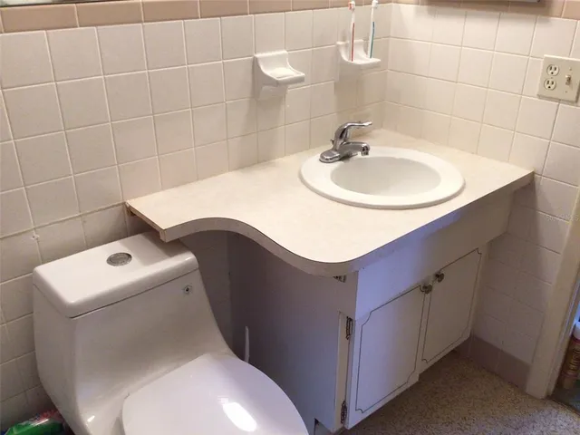 a bathroom with a toilet and a sink