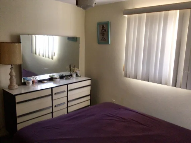 a room with a bed and a window