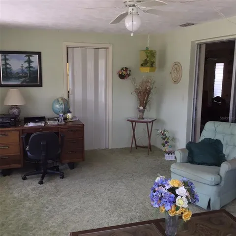 a bedroom with a workspace