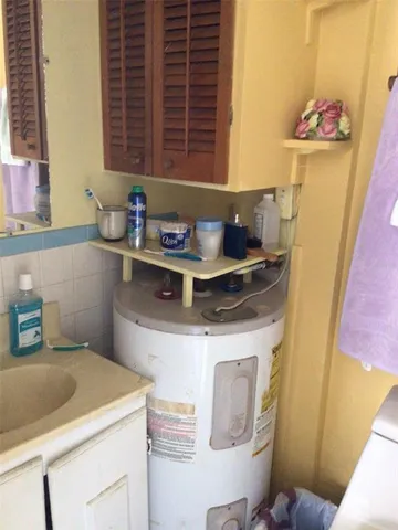 a utility room with a sink washer and dryer