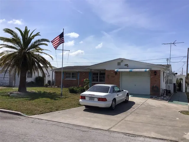 a car parked in front of a house