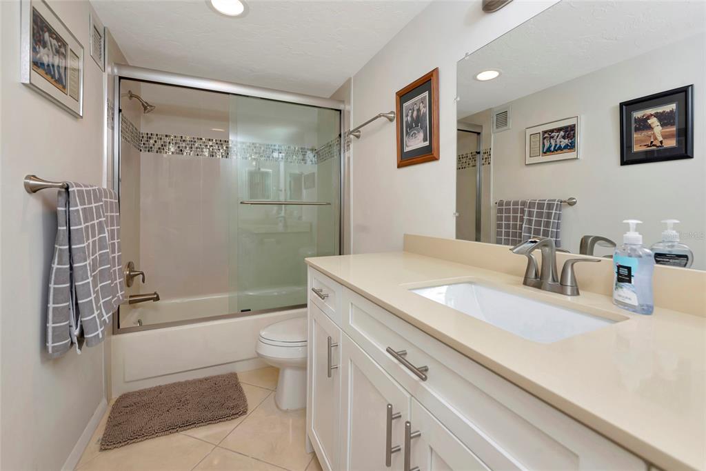 101 South Gulfstream Avenue, Unit 16C Sarasota, FL 34236 - Photo 11 of 86 a bathroom with a sink a toilet and shower