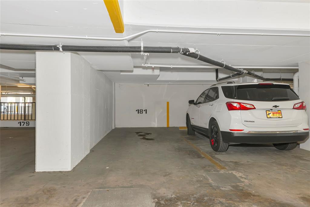 101 South Gulfstream Avenue, Unit 16C Sarasota, FL 34236 - Photo 15 of 86 a white car parked in a parking garage