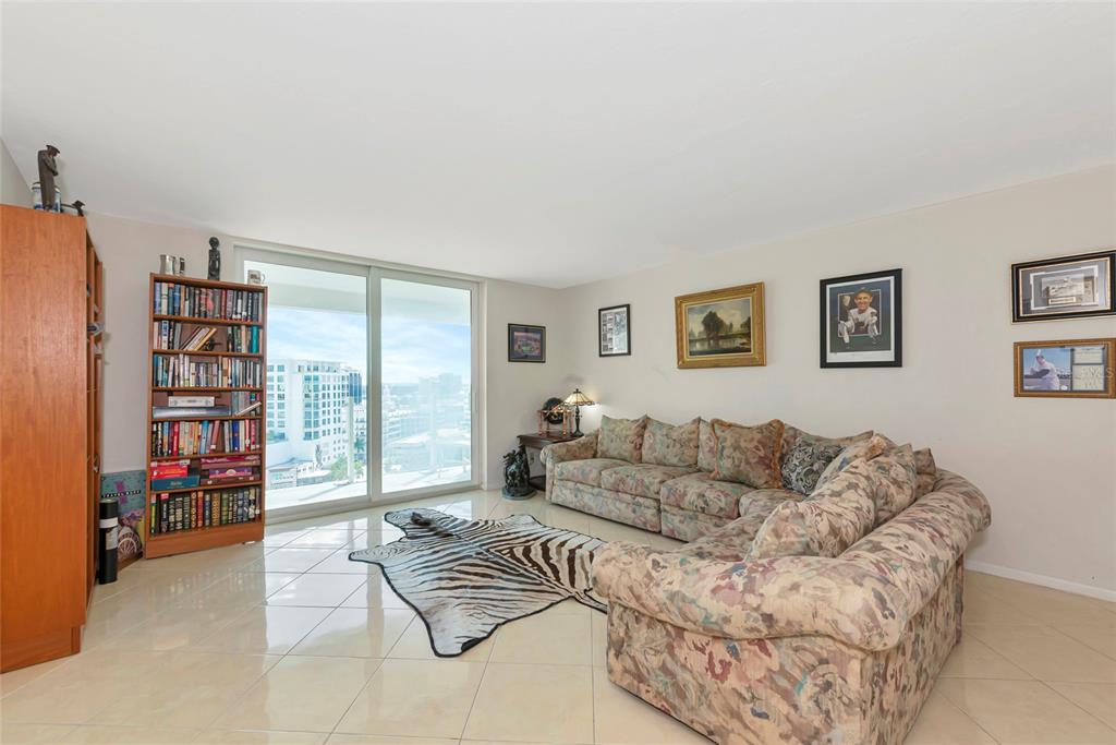 101 South Gulfstream Avenue, Unit 16C Sarasota, FL 34236 - Photo 28 of 86 a living room with furniture and a large window