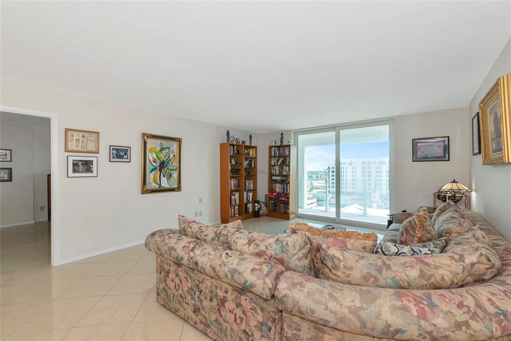 101 South Gulfstream Avenue, Unit 16C Sarasota, FL 34236 - Photo 29 of 86 a bed sitting in a bedroom next to a window