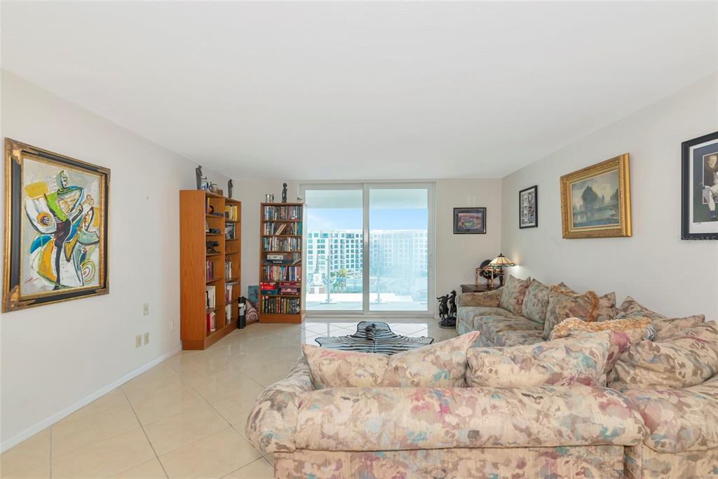 101 South Gulfstream Avenue, Unit 16C Sarasota, FL 34236 - Photo 30 of 86 a bed room with a bed and a couch