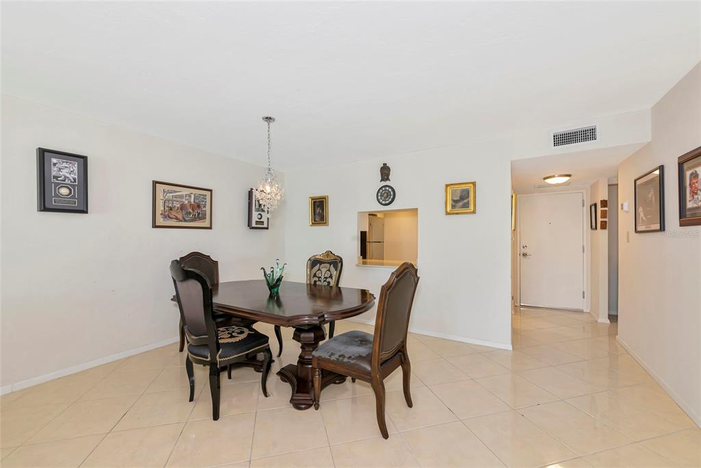 101 South Gulfstream Avenue, Unit 16C Sarasota, FL 34236 - Photo 32 of 86 a view of a dining room with furniture