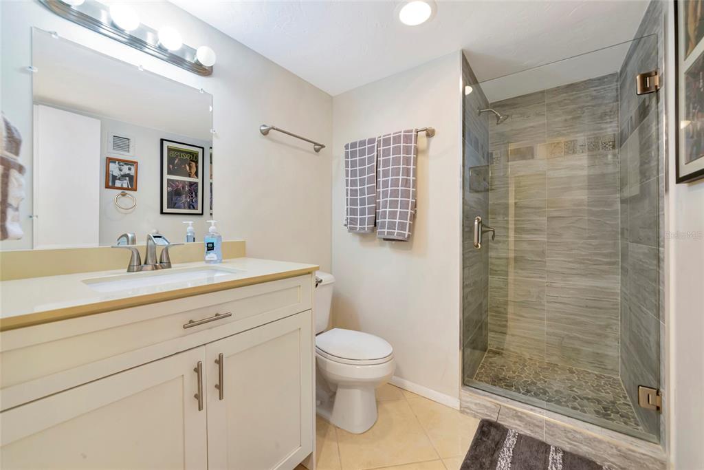 101 South Gulfstream Avenue, Unit 16C Sarasota, FL 34236 - Photo 35 of 86 a bathroom with a sink a toilet and shower