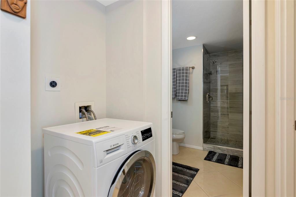 101 South Gulfstream Avenue, Unit 16C Sarasota, FL 34236 - Photo 36 of 86 a view of storage and utility room with washer and dryer
