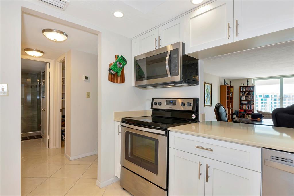 101 South Gulfstream Avenue, Unit 16C Sarasota, FL 34236 - Photo 40 of 86 a kitchen with a stove and a microwave
