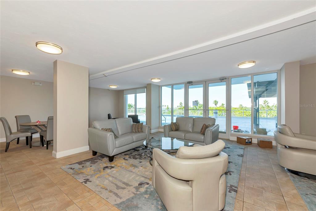 101 South Gulfstream Avenue, Unit 16C Sarasota, FL 34236 - Photo 46 of 86 a living room with furniture and a large window