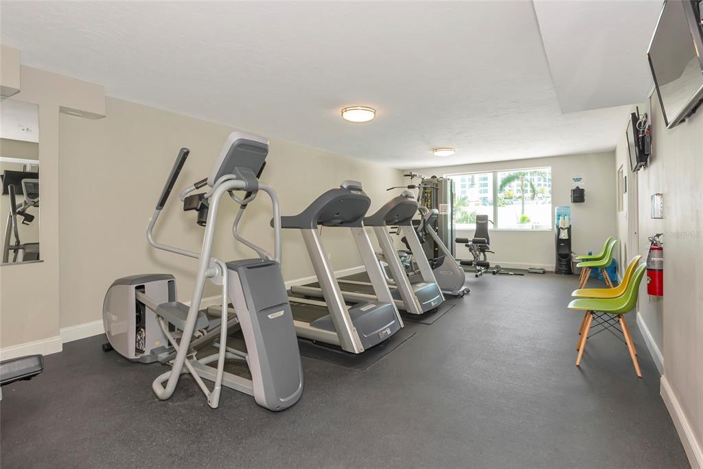 101 South Gulfstream Avenue, Unit 16C Sarasota, FL 34236 - Photo 48 of 86 a view of a room with gym equipment