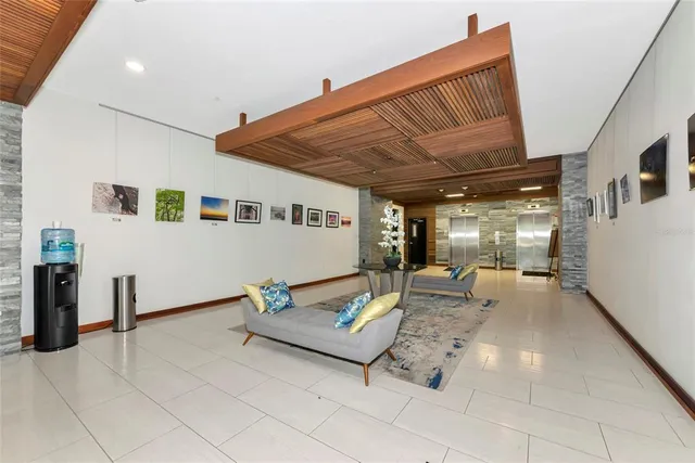 a view of a lake with lawn chairs