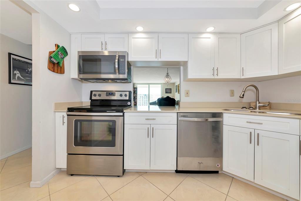 101 South Gulfstream Avenue, Unit 16C Sarasota, FL 34236 - Photo 8 of 86 a kitchen with cabinets stainless steel appliances and counter space