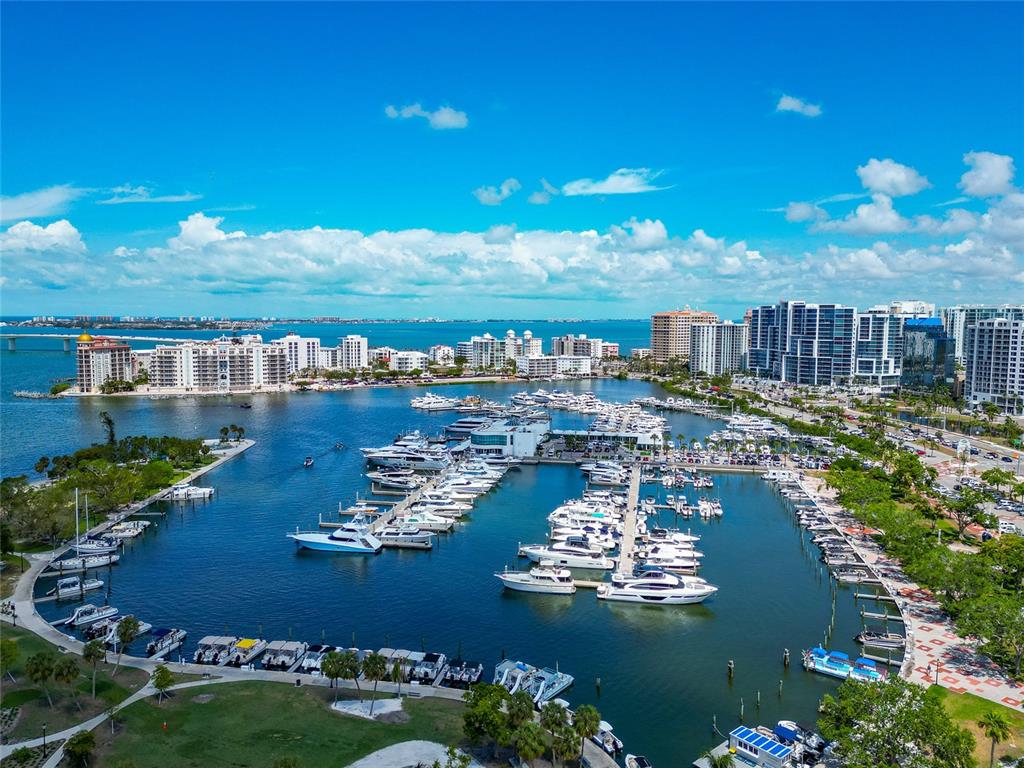 101 South Gulfstream Avenue, Unit 16C Sarasota, FL 34236 - Photo 84 of 86 a view of a lake with lawn chairs
