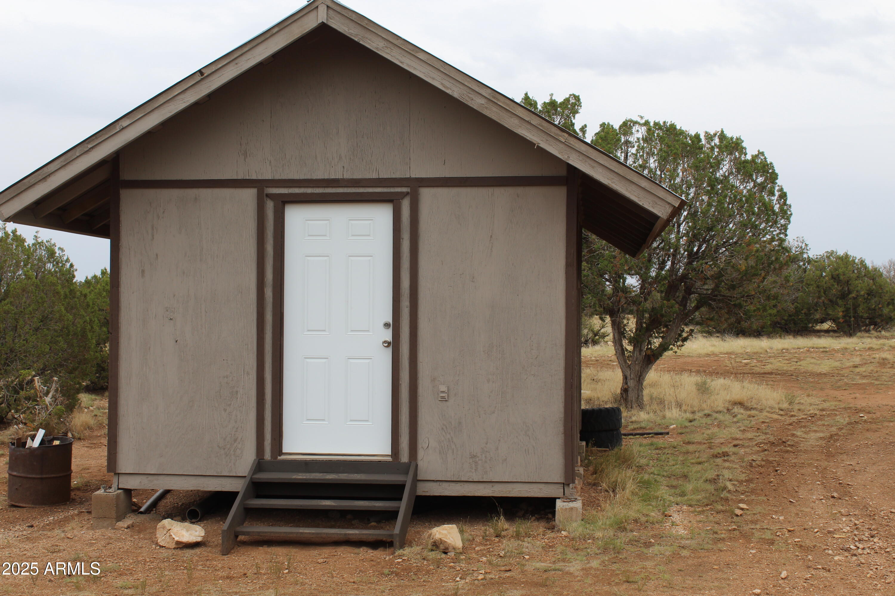 979 Elk Run Heber, AZ 85928 - Photo 5 of 12 a house with trees in the background